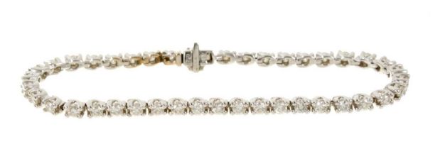 Diamond tennis bracelet with a full line of brilliant cut diamonds estimated to weigh approximately