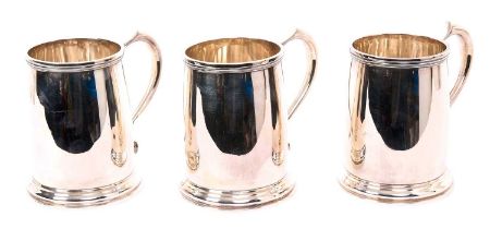 Set of three 1930s silver mugs
