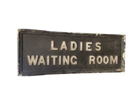 Ladies waiting room sign, c.1910 original and worn black paint with raised white lettering