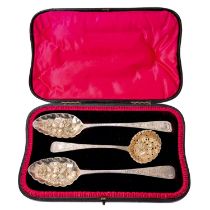 Pair of Georgian silver berry spoons and sugar sifting spoon in fitted box