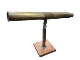 Brass 1950s astronomical telescope on a wooden base, made for a child