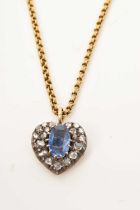 Antique diamond and sapphire heart shape pendant on an antique gold chain