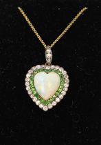 A fine late Victorian opal diamond and green garnet heart shape pendant on chain