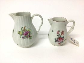 Two 18th century Worcester sparrow beak cream jugs, one with a fluted body, both polychrome decorate