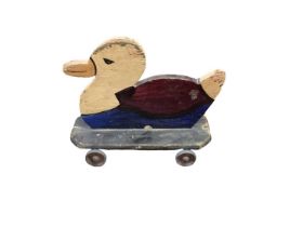 Homemade wooden toy duck on wheels, 9inches x 7inches, with original paint an alloy wheels, c1930s