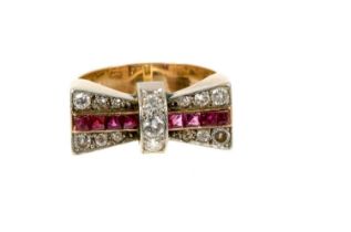 Art Deco Odeonesque diamond and ruby ring in the form of a bow, circa 1950.