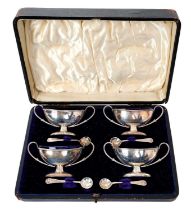 Set of four Edwardian silver salt cellars in a fitted case (London 1909)