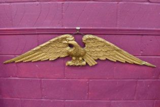 Antique carved giltwood eagle overdoor