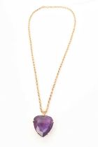 Large amethyst heart shape pendant with a fancy cut heart shaped amethyst in 9ct gold setting on a 9