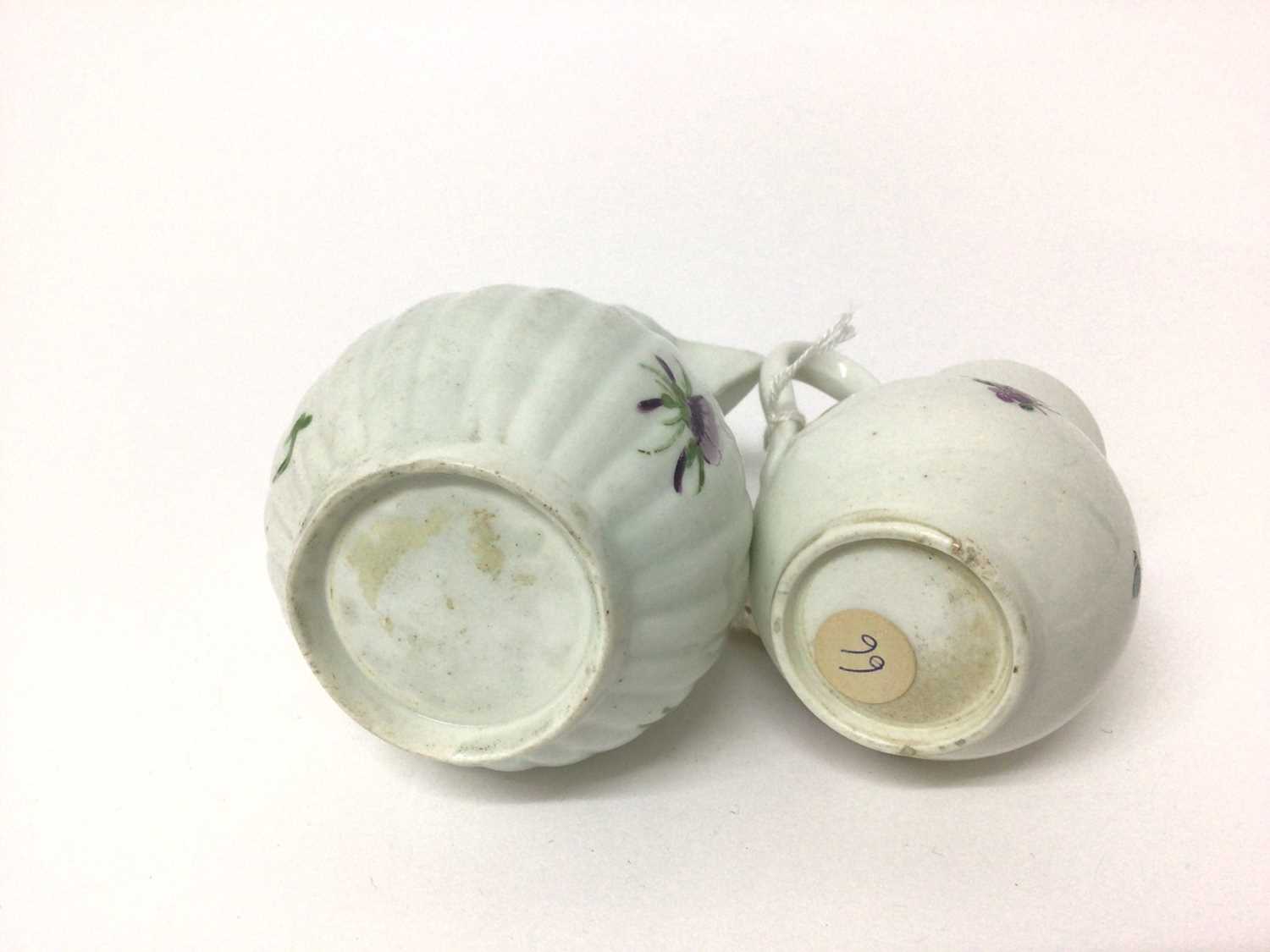 Two 18th century Worcester sparrow beak cream jugs, one with a fluted body, both polychrome decorate - Image 3 of 4