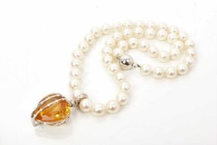 Good quality citrine and diamond heart shaped pendant on a string of cultured pearls, with a large h