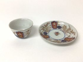 Small 18th century Japanese Imari porcelain tea bowl and saucer, with floral decoration, the saucer