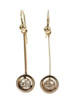 Pair of Edwardian diamond pendant earrings, each with an old cut diamond in platinum millegrain sett