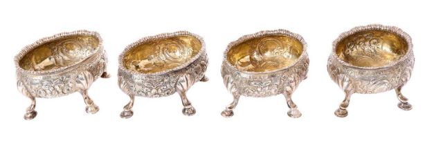 Set of four George II silver salts of oval form, with embossed floral decoration