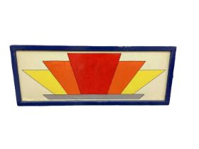 Fairground art panel with geometric design in strong primary colours or red, orange and yellow.