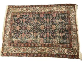 Antique Persian rug and three others