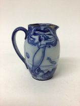Early 20th century Royal Doulton flow blue jug decorated in the Art Nouveau style with mermaids and