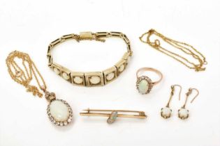 A group of antique opal jewellery to include an opal and synthetic white stone pendant and ring, an