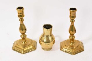 Pair of Queen Anne brass candlesticks, together with 18th century bell metal jug