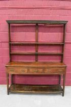 Mid-18th century oak high dresser, the shelved top with original cup hooks, the base having three dr