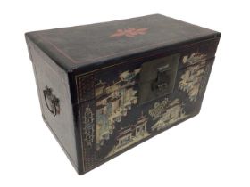 Chinese papier mâché trunk, with flanking carrying handles, decorated with landscape reserves, 43cm
