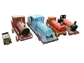 Three red painted wooden and one blue painted wood and metal home made trains, c1950s. One homemade