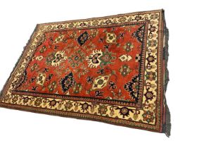 Caucasian Kasak rug, with angular foliate design on brick red ground