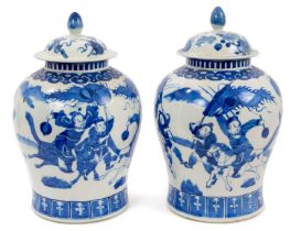 Pair of 19th century Chinese Kangxi style blue and white baluster vases, decorated with figures, six