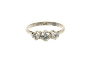 Diamond three stone ring with three brilliant cut diamonds in claw setting on platinum shank, estima