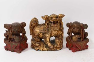 Antique Chinese carved gilt Buddhist lion and pair of carved guardians