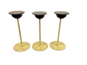 Set of three painted metal window display stands