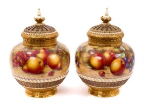 Pair of Royal Worcester pot pourri vases, covers and inner covers, painted by Freeman