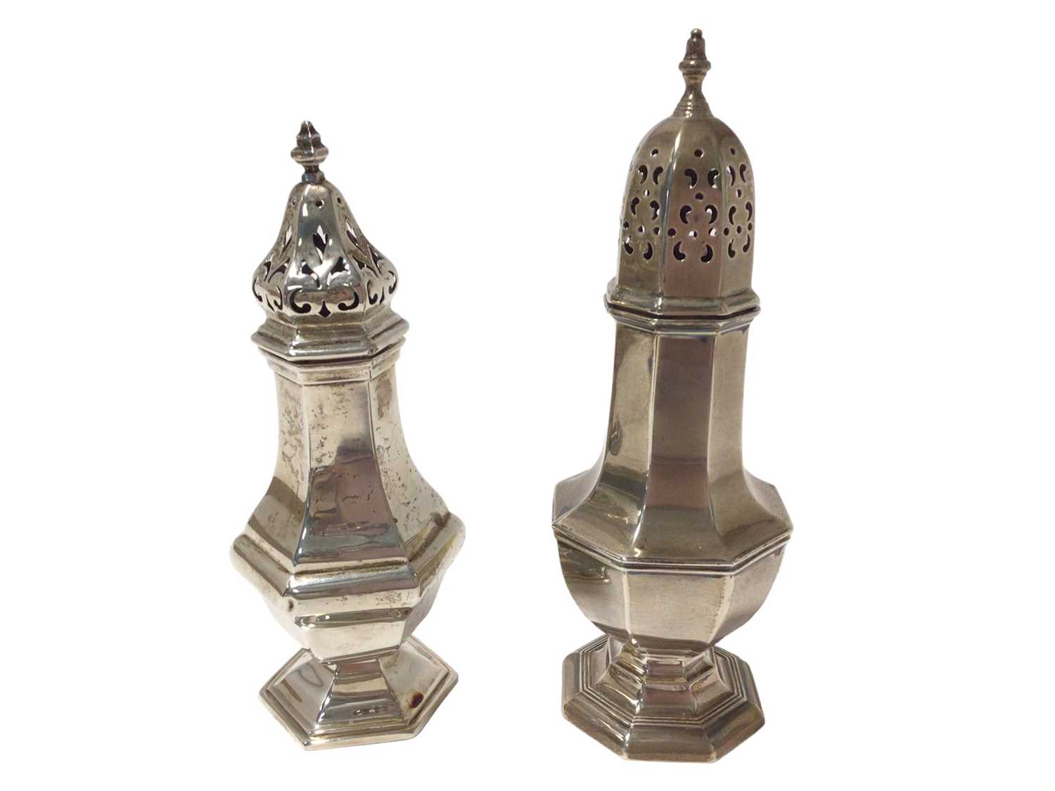 George V silver caster of hexagonal baluster form, together with another, similar