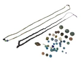 Egyptian celadon necklace and a similar necklace and Roman glass beads