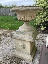 Large pair of reconstituted stone garden urms of campagna form with egg and dart rim, reeded bowl on