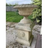 Large pair of reconstituted stone garden urms of campagna form with egg and dart rim, reeded bowl on