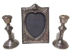 Contemporary silver photograph frame, with embossed decoration and a pair of candlesticks