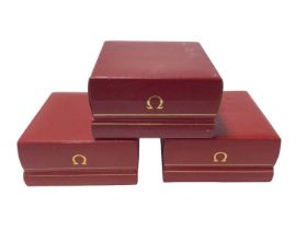 Three empty Omega watch boxes