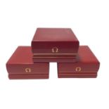 Three empty Omega watch boxes