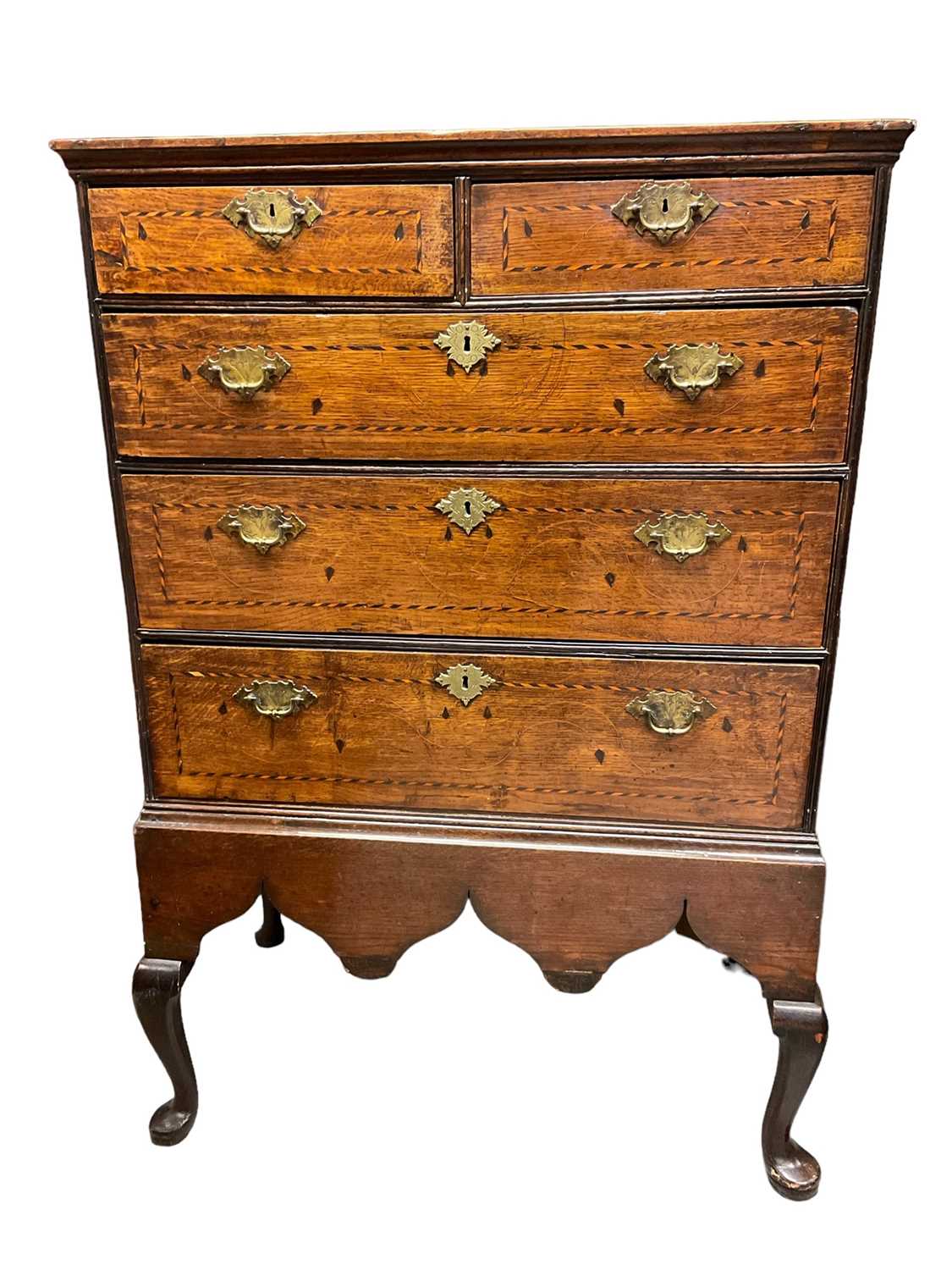 Early 18th century oak and barber pole strung chest on integral stand.