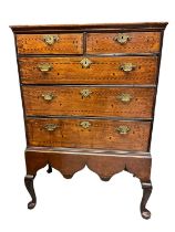 Early 18th century oak and barber pole strung chest on integral stand.