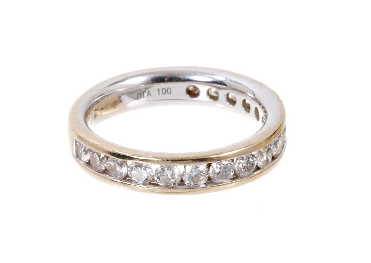 Diamond eternity ring with a band of brilliant cut diamonds in 18ct white gold channel setting