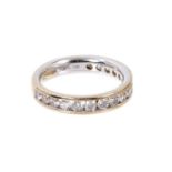 Diamond eternity ring with a band of brilliant cut diamonds in 18ct white gold channel setting