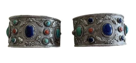 Pair of Chinese silver and gem set cuff bangles, each with a lapis lazuli, turquoise and coral caboc