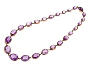 Victorian amethyst and gold rivière necklace with graduated oval mixed cut amethysts in gold collet