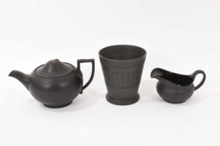 Wedgwood black basalt vase, a milk jug and a teapot and cover