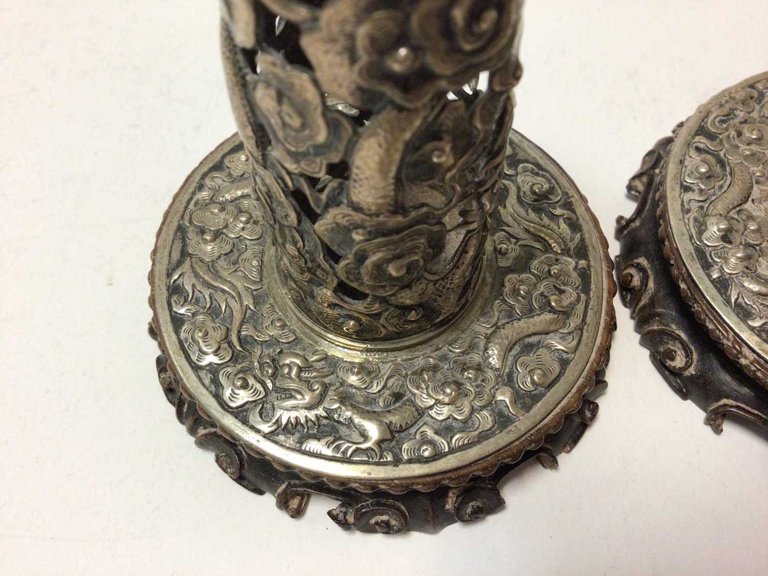 Pair of Chinese white metal candlesticks with pierced dragon decoration on carved wood bases - Image 5 of 6