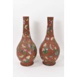 Large pair of Watcombe style terracotta bottle vases with enamelled decoration