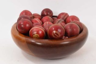 Wooden bowl housing 35 vintage cricket balls