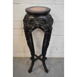 Late 19th century Chinese carved hardwood plant stand with marble inset top